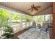 Relaxing sunroom featuring a ceiling fan, comfortable seating, and serene views of the backyard at 105 Kirkhaven Ct, Goose Creek, SC 29445
