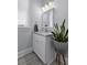 Bright bathroom featuring a white vanity, marble countertop, and modern lighting fixtures at 1104 Beresford Run, Charleston, SC 29492
