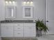 Bright bathroom with double vanity, white cabinets, and natural light at 1104 Beresford Run, Charleston, SC 29492