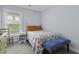 Bright bedroom with a ceiling fan, a large window, and a comfortable floral-patterned bed at 1104 Beresford Run, Charleston, SC 29492