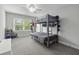 This bedroom features bunkbeds with gray frames and carpeted floors and three windows at 1104 Beresford Run, Charleston, SC 29492