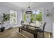 Cozy dining area featuring a rustic table, chairs, bench seating, and natural lighting at 1104 Beresford Run, Charleston, SC 29492