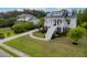 Charming two-story home with a welcoming staircase and columns, a circular driveway, and lush landscaping at 1104 Beresford Run, Charleston, SC 29492