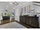 Elegant foyer with a wooden console, staircase, and an open living space featuring a fireplace at 1104 Beresford Run, Charleston, SC 29492