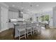 A spacious kitchen features an island with seating, modern appliances, and hardwood floors at 1104 Beresford Run, Charleston, SC 29492