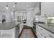Bright kitchen with white cabinetry, stainless steel appliances, gray counters, and a large central island at 1104 Beresford Run, Charleston, SC 29492