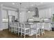 A spacious kitchen features a central island with seating, modern appliances, and ample cabinet space at 1104 Beresford Run, Charleston, SC 29492