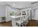 Bright kitchen with stainless appliances, white cabinets and island with bar seating for four at 1104 Beresford Run, Charleston, SC 29492