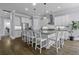 Spacious kitchen featuring a central island with seating, stainless appliances and white cabinetry at 1104 Beresford Run, Charleston, SC 29492