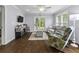 Bright living room with hardwood floors, comfortable seating, and sliding doors leading to outdoors at 1104 Beresford Run, Charleston, SC 29492