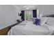 Neutral bedroom featuring hardwood floors, a ceiling fan, and patio access at 1104 Beresford Run, Charleston, SC 29492