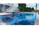 Backyard pool with lit waterfall feature and outdoor lounge area for upscale entertaining at 1104 Beresford Run, Charleston, SC 29492