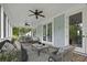 Screened porch with comfortable seating, ceiling fans, and views of the surrounding greenery at 1104 Beresford Run, Charleston, SC 29492