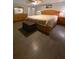 Well-lit bedroom with a large bed, wooden furniture, and wood flooring at 1120 Seaside Ln, Charleston, SC 29412