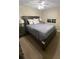 Comfortable bedroom features a bed with lamps, ceiling fan, and natural light at 1120 Seaside Ln, Charleston, SC 29412