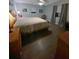 Comfortable bedroom with a large bed and dark wood floors at 1120 Seaside Ln, Charleston, SC 29412
