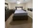 Comfortable bedroom features a dark wood bedroom set and natural light at 1120 Seaside Ln, Charleston, SC 29412
