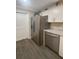 Updated kitchen featuring a stainless steel refrigerator, dishwasher, and white cabinets at 1120 Seaside Ln, Charleston, SC 29412