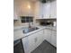 Bright kitchen featuring a modern sink, white cabinets, and ample counter space at 1120 Seaside Ln, Charleston, SC 29412