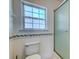 Bathroom with tiled walls, shower, and window at 118 Willowbend Ln, Summerville, SC 29485
