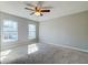 Spacious bedroom with neutral carpet, ceiling fan and two windows providing natural light at 118 Willowbend Ln, Summerville, SC 29485