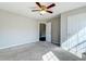Bedroom featuring a neutral-colored carpet, ceiling fan, closet and attached bathroom at 118 Willowbend Ln, Summerville, SC 29485