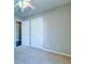 Comfortable bedroom with a ceiling fan, soft carpet, and attached bathroom at 118 Willowbend Ln, Summerville, SC 29485