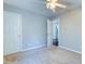 Cozy bedroom with neutral carpet, ceiling fan, closet and bathroom entry at 118 Willowbend Ln, Summerville, SC 29485
