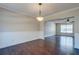 Bright dining room with dark wood floors, updated lighting, and neutral paint, creating a welcoming atmosphere at 118 Willowbend Ln, Summerville, SC 29485