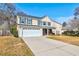 Charming two-story home with a manicured lawn, driveway, and attached garage at 118 Willowbend Ln, Summerville, SC 29485