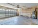 Spacious garage with ample storage space, featuring built-in shelving and an automatic garage door opener at 118 Willowbend Ln, Summerville, SC 29485
