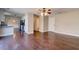 Spacious living room with an open layout, dark wood floors, and access to the kitchen and hallway for easy living at 118 Willowbend Ln, Summerville, SC 29485