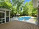 Beautiful backyard pool with deck, and a screened-in porch providing a great view of the yard and pool at 130 Delaney Cir, Summerville, SC 29485