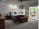 Bedroom with a comfortable bed, nightstand and access to the screened in patio at 130 Delaney Cir, Summerville, SC 29485