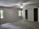 Bright bedroom with neutral walls, large windows, and a walk-in closet for plenty of storage at 130 Delaney Cir, Summerville, SC 29485