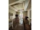 Bright living room with tray ceilings, hardwood floors, a classic chandelier, and abundant natural light at 130 Delaney Cir, Summerville, SC 29485