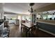 Open-concept living room and kitchen area with hardwood floors and a decorative light fixture above dining table at 130 Delaney Cir, Summerville, SC 29485