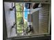Looking from inside the screened in porch towards the outside pool and garden area at 130 Delaney Cir, Summerville, SC 29485
