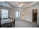 Bright bedroom features a ceiling fan, closet, and attached bathroom at 1341 Belle Grove Cir, Hanahan, SC 29410