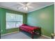 A bedroom featuring green walls, carpeted floors, ceiling fan, and a single bed at 1341 Belle Grove Cir, Hanahan, SC 29410