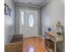 Inviting entryway with hardwood floors and a decorative table with unique decor at 1341 Belle Grove Cir, Hanahan, SC 29410