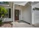 Close-up of the home's entrance featuring a decorative front door and attached garage at 1341 Belle Grove Cir, Hanahan, SC 29410