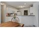 Kitchen and dining space with white cabinets and dining table at 1341 Belle Grove Cir, Hanahan, SC 29410