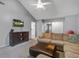 Comfortable living room featuring a large sectional, TV, and cozy carpet at 1341 Belle Grove Cir, Hanahan, SC 29410