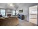 Bright living room with fireplace, TV, large sectional and doorway to kitchen at 1341 Belle Grove Cir, Hanahan, SC 29410
