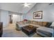 Cozy living room with a large sectional sofa and a ceiling fan at 1341 Belle Grove Cir, Hanahan, SC 29410