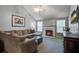 Comfortable living room with a fireplace, soft carpet, and neutral gray paint at 1341 Belle Grove Cir, Hanahan, SC 29410