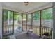 A screened-in patio with an outdoor ceiling fan at 1341 Belle Grove Cir, Hanahan, SC 29410