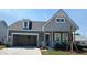 Charming single-Gathering home with a craftsman-style design, attached garage, and beautifully landscaped front yard at 135 Summerwind Dr, Summerville, SC 29486