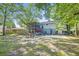 Spacious backyard with a screened porch, patio area, and ample green space at 14 Newark Ave, Goose Creek, SC 29445